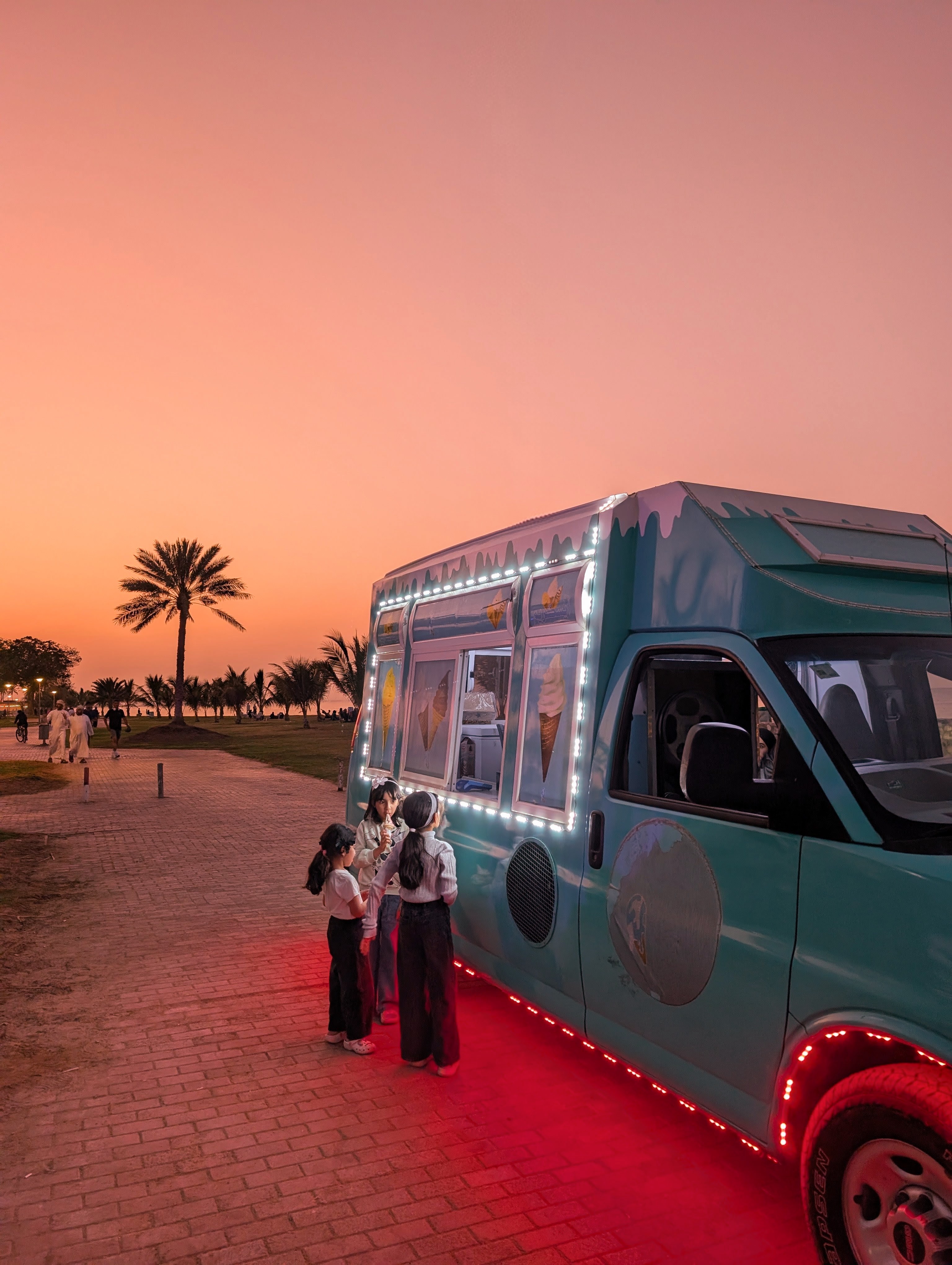Qurum Beach at sunset with an ice-cream truck in Muscat
